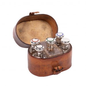 Leather case with cologne bottles and 19th century silver punched stoppers, london, England, Dorantes saddlery