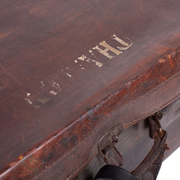 Large brown travel suitcase.Large travel suitcase. Thallon inscription. Leather and metal exterior with textile interior.