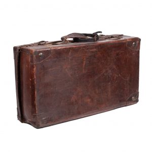 Large brown travel suitcase.Large travel suitcase. Thallon inscription. Leather and metal exterior with textile interior.