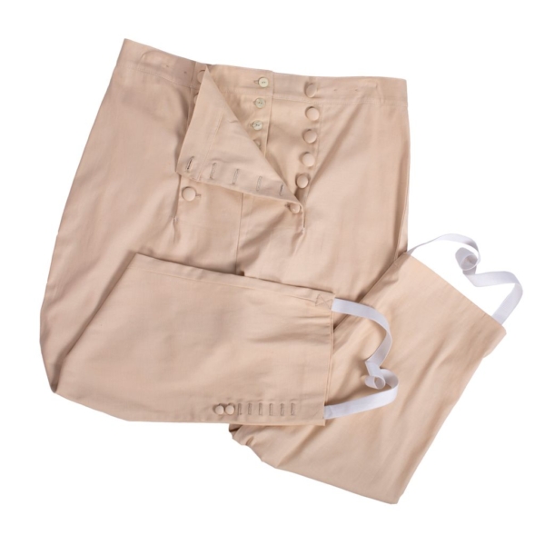Breeches with buttons for coachmen. Beige fabric breeches with buttons for coachmen