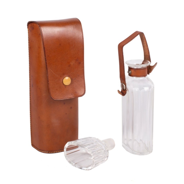 Set of glass jar and glass vessel that acts as a stopper. Brown leather case