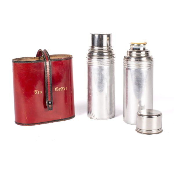 Two antique thermos flasks with red leather case.